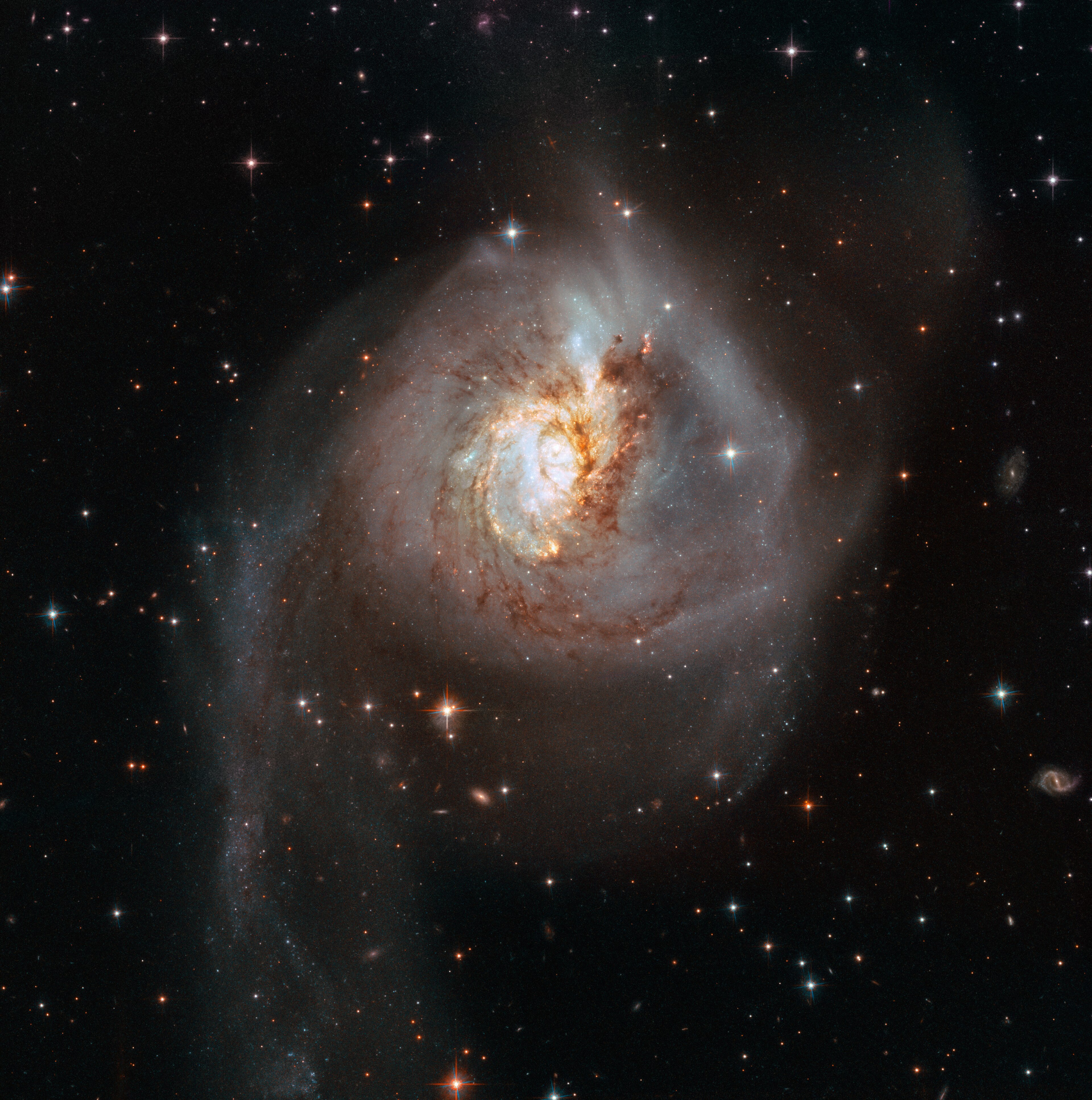 NGC 3256, a luminous infrared galaxy formed by the merger of two spiral galaxies