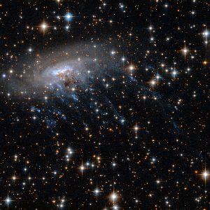 ESO 137-001, the Jellyfish Galaxy in the Norma Cluster, exhibiting dramatic ram-pressure stripping