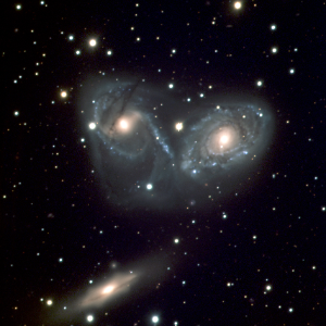 The Devil's Mask — NGC 6769, NGC 6770, and NGC 6771, a gravitationally bound triplet system undergoing active merger in the Southern Filament