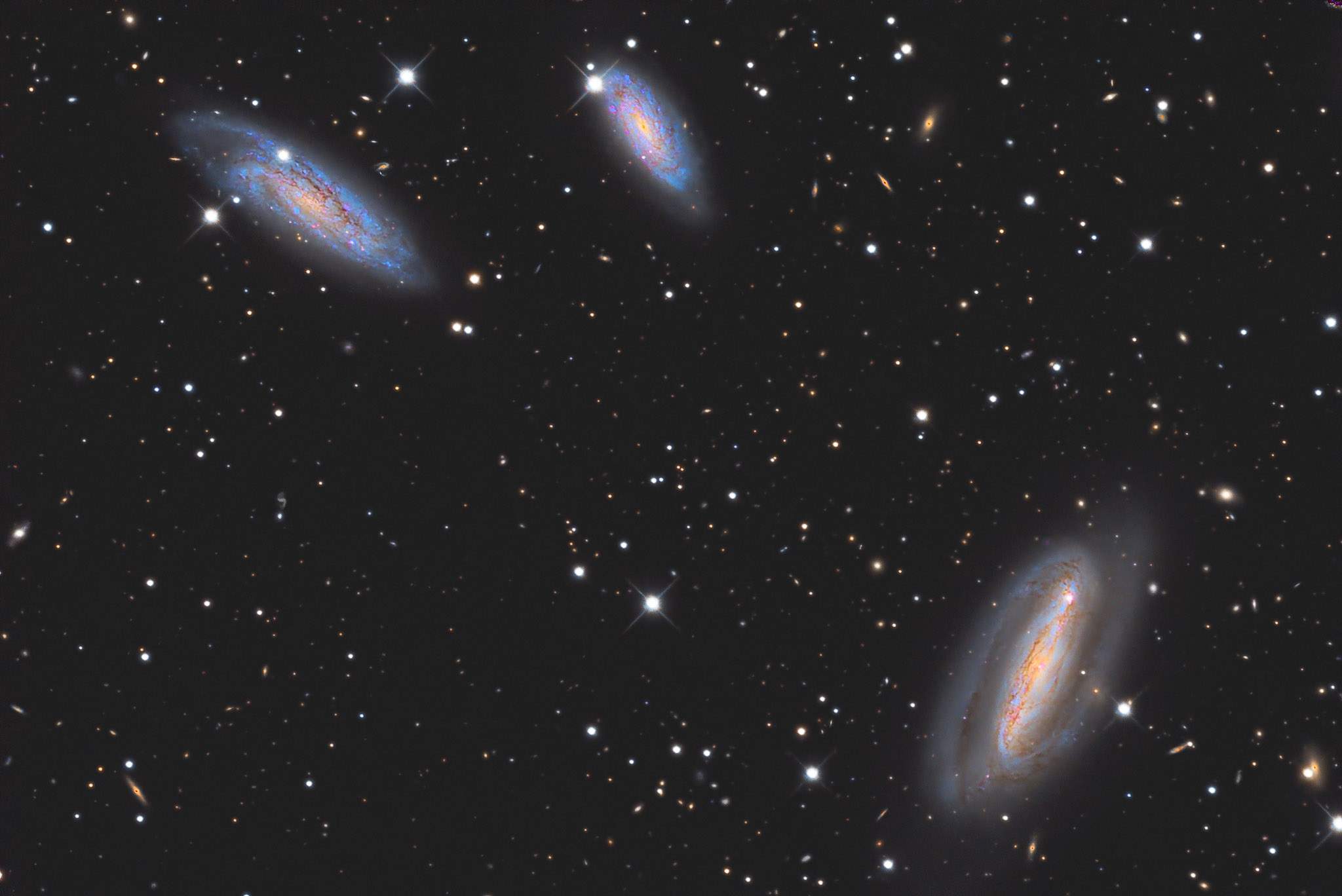 NGC 7582, NGC 7590, and NGC 7599, three members of the Grus Quartet
