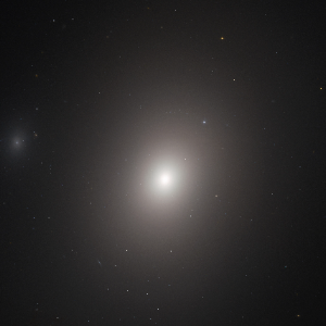 M86, the blueshifted elliptical galaxy at the center of Markarian's Chain, plunging into the Virgo Cluster core at high velocity
