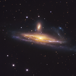 NGC 1532 (Haley's Coronet), a massive spiral galaxy in the act of devouring its smaller companion