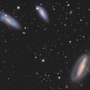 NGC 7582, NGC 7590, and NGC 7599, three members of the Grus Quartet